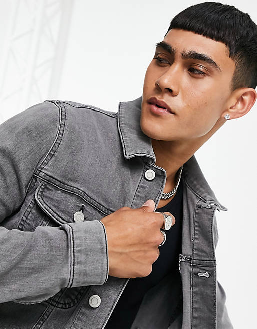 Close-up of grey denim jacket collar and pocket