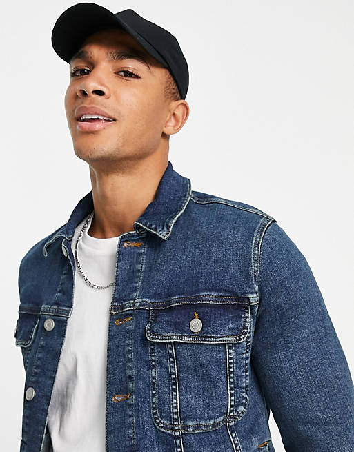 Close-up of dark blue denim jacket pockets